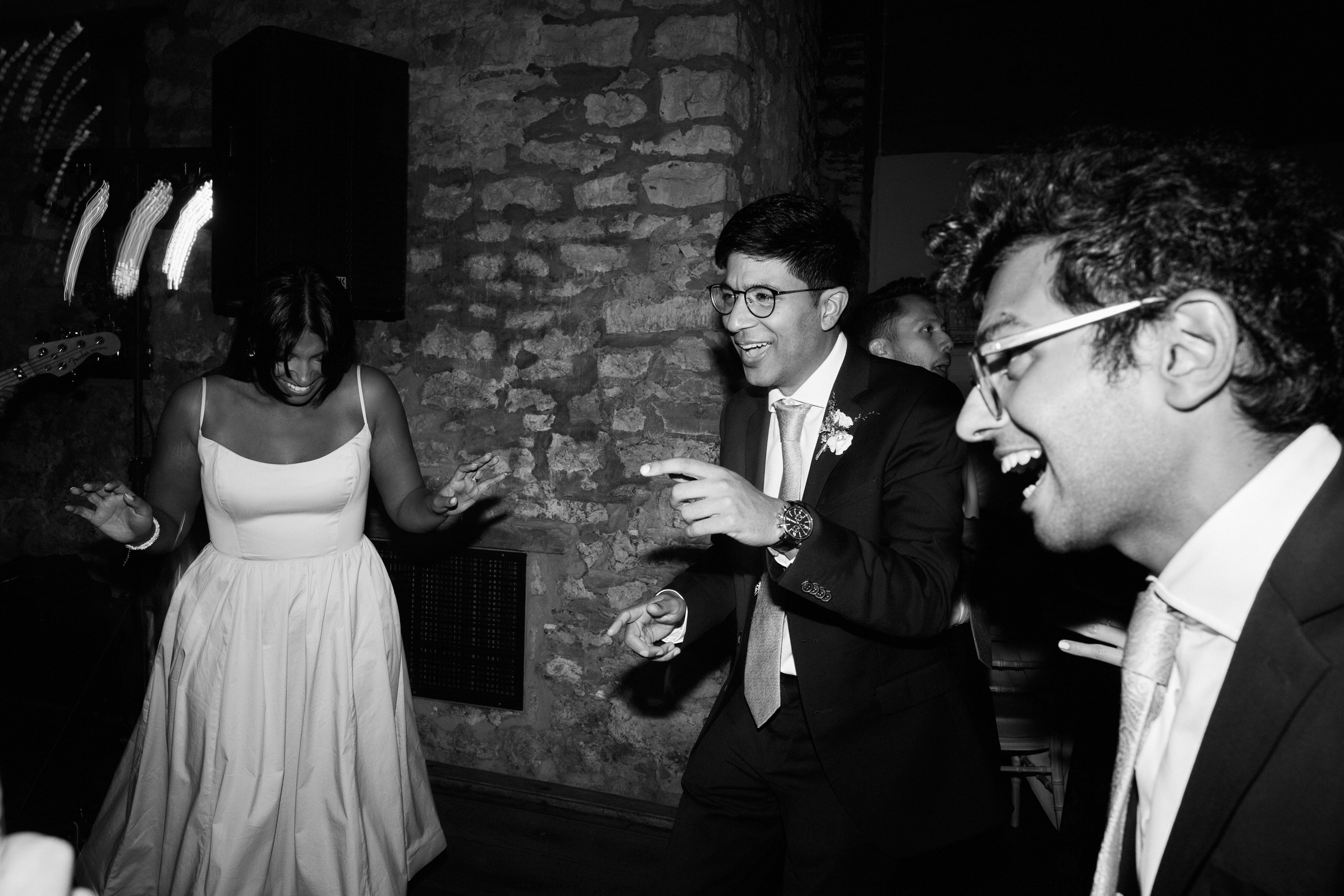A couple is dancing at their wedding party.