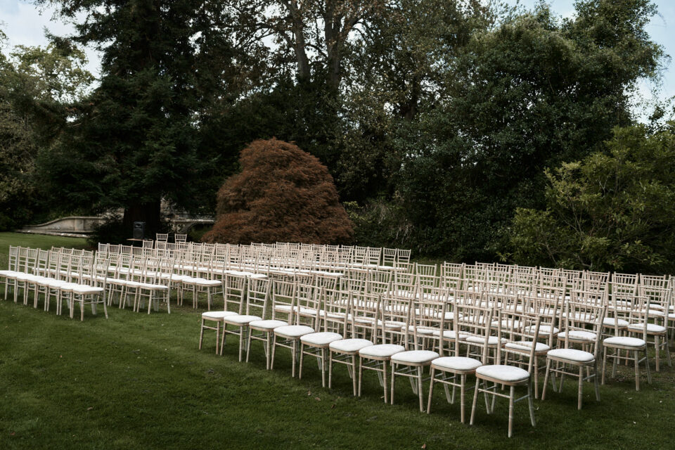 A marriage ceremony set up in a lawn area.