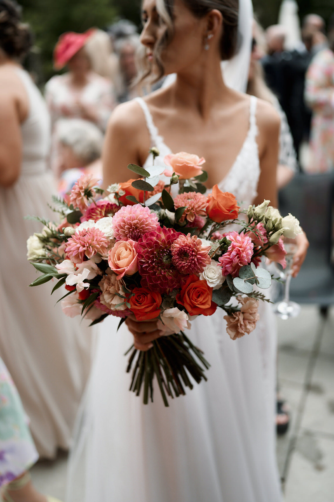 A bride holding a bouquet of flowers at a wedding.