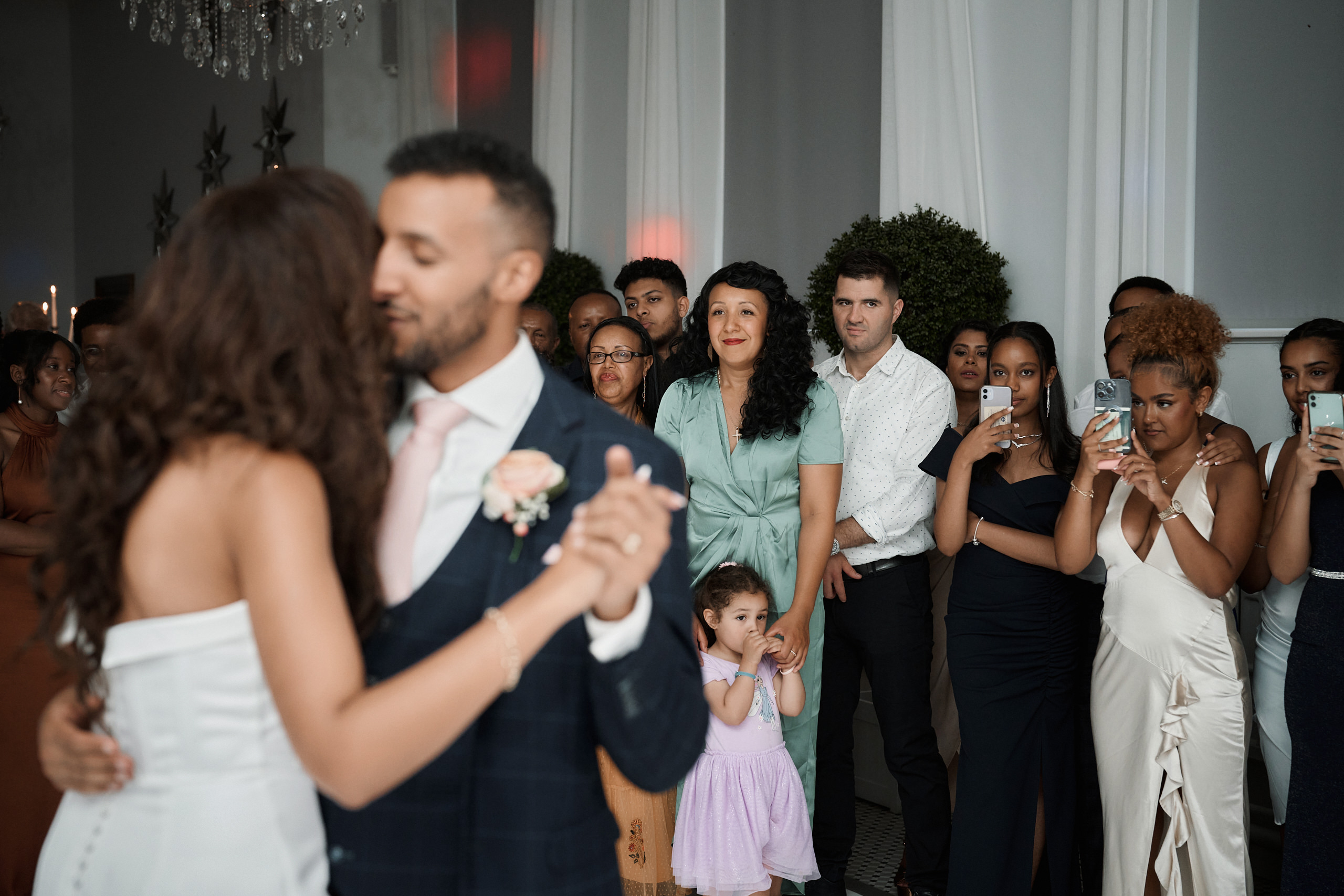 A couple having their first dance at their wedding party.