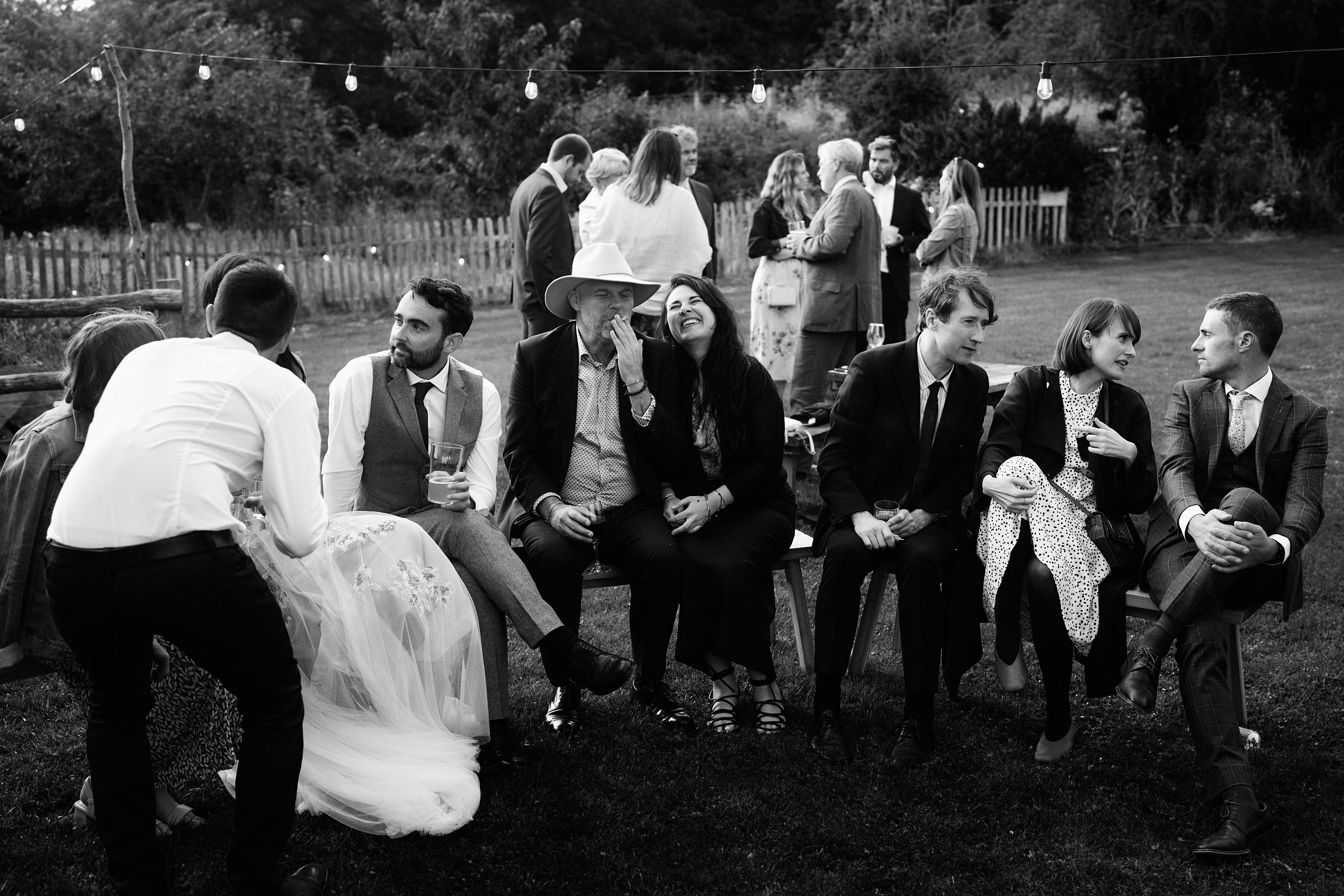 A black and white picture showing a crowd at a wedding.