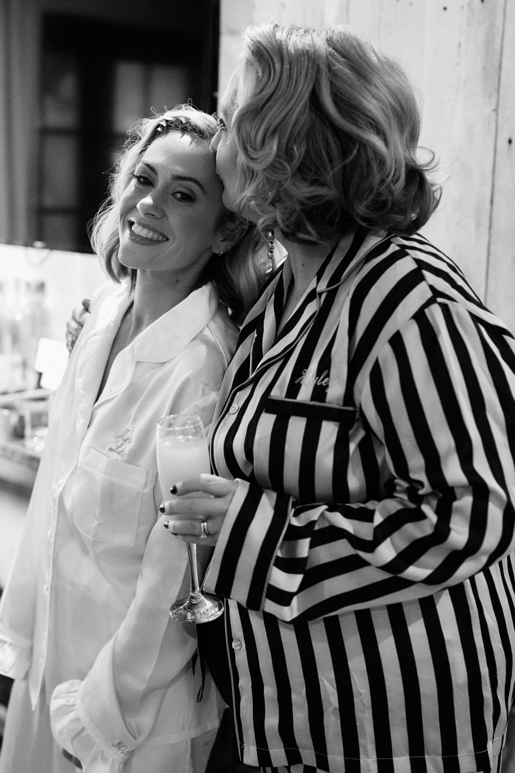 A black and white picture of two ladies in their PJs.